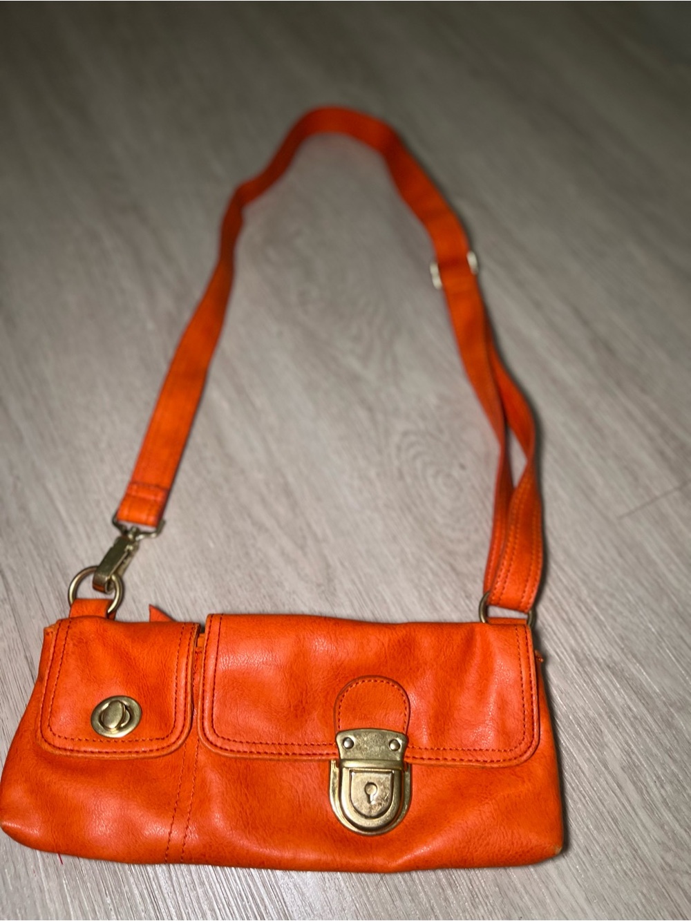 mark. Orange Leather Crossbody Mini Bag with Brass Hardware